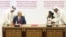 U.S. peace envoy Zalmay Khalilzad (left) and Mullah Abdul Ghani Baradar, the Taliban's top political leader, sign the peace agreement between Taliban and U.S. officials in Doha on February 29, 2020.