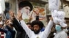 Supporters of extremist political party Tehreek-e Labbaik Pakistan (TLP) chant slogans during a protest in Lahore (file photo)