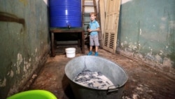 Ten-year-old Sasha stands in a bomb shelter in Donetsk in eastern Ukraine.