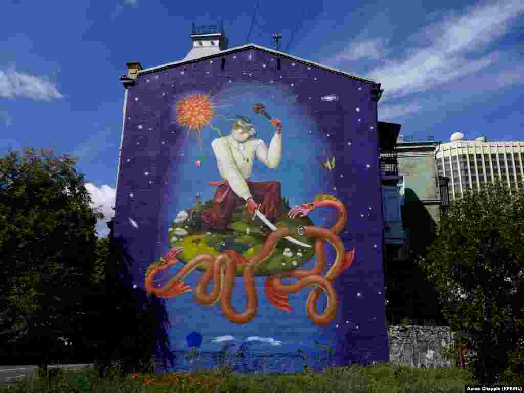 «Український святий Георгій», авторства українського арт-дуету Interesni Kazki, зображає змія, що хапає землю і зі сходу, і з заходу. Художники написали про цей мурал на своєму сайті: «Наша країна в центрі геополітичної конфронтації. Її намагаються розділити й розірвати на шматки дві цивілізації: східна – Росія і західні країни у формі блоку НАТО. А для України ці дві цивілізації – по суті, одне чудисько-змій» (вулиця Велика Житомирська, 38)