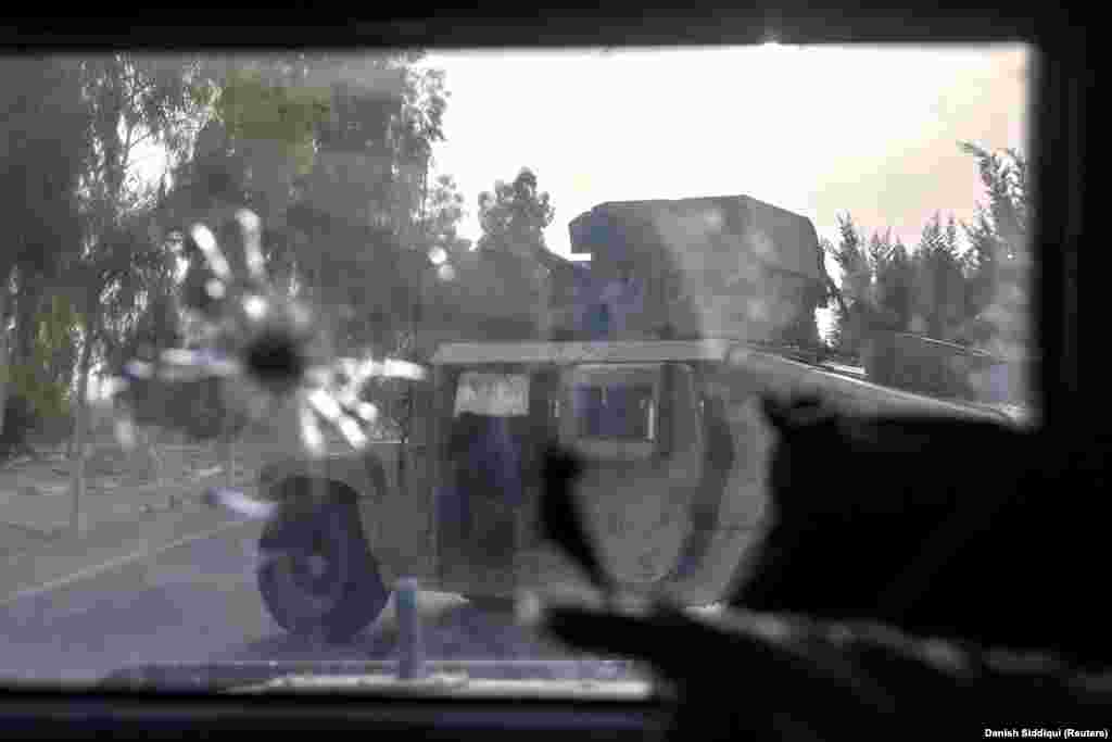 A Humvee wrecked during the July 13 rescue mission. Three of the eight vehicles used in the operation took direct hits from RPGs and had to be left behind. 