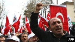 Members of a pro-government labor union demonstrate outside the French Embassy in Ankara over the proposed French law.