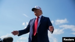 აშშ-ის პრეზიდენტი დონალდ ტრამპი ენდრიუსის ავიაბაზაზე პასუხობს ჟურნალისტების შეკითხვებს. 2025 წლის 3 ივლისი