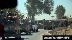 Afghan security officials patrol the Helmand-Kandahar highway. (file photo)