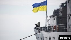 A Ukrainian Navy sailor stands guard on the "Slavutych" flagship in Sevastopol on March 18. The ship was seized by pro-Russian forces four days later.