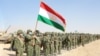 Members of Tajikistan's armed forces line up during joint military drills involving Russia, Uzbekistan, and Tajikistan at the Harb-Maidon training ground near the border with Afghanistan on August 10.